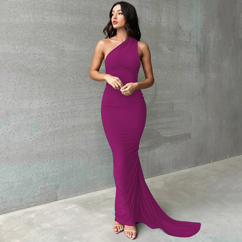 A backless, off-the-neck, body-hugging evening dress