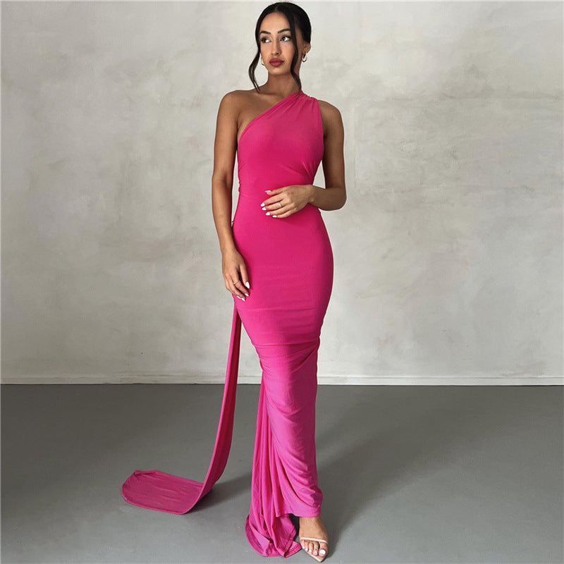 A backless, off-the-neck, body-hugging evening dress