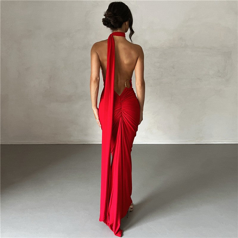 A backless, off-the-neck, body-hugging evening dress