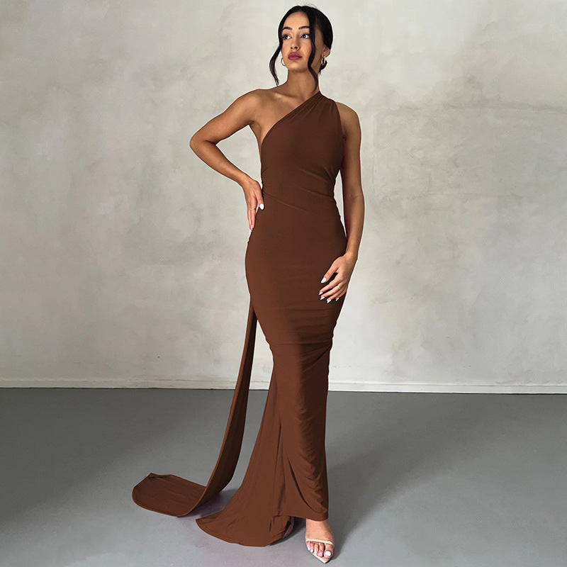 A backless, off-the-neck, body-hugging evening dress