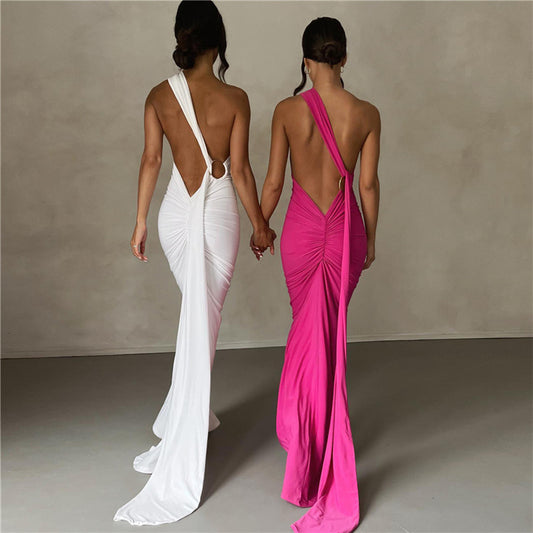 A backless, off-the-neck, body-hugging evening dress