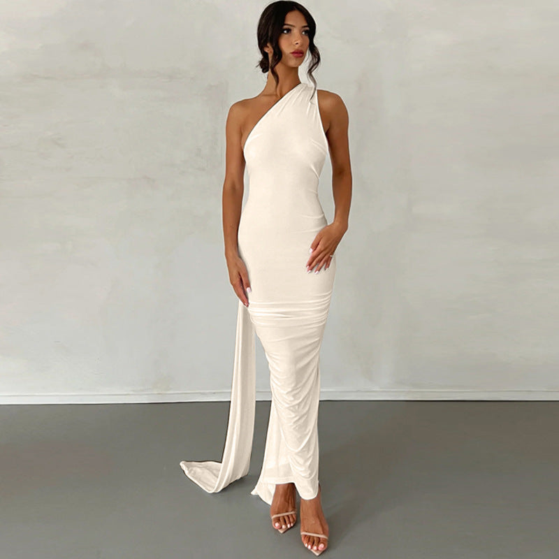 A backless, off-the-neck, body-hugging evening dress