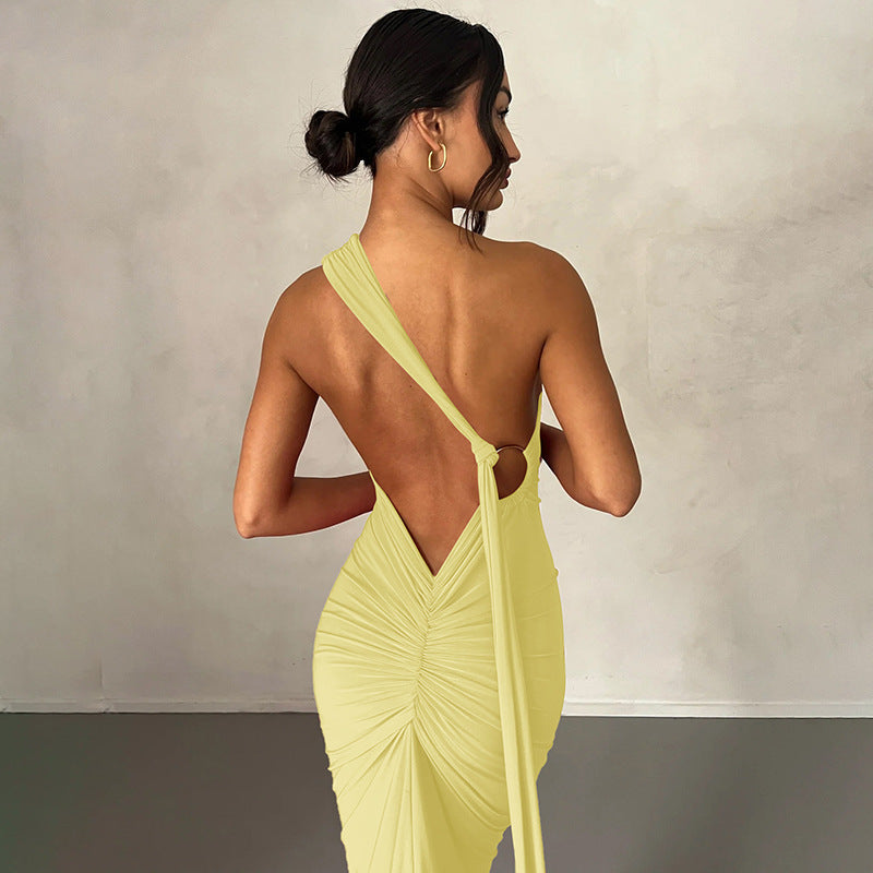 A backless, off-the-neck, body-hugging evening dress